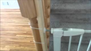 install safety gate on banister of staircase