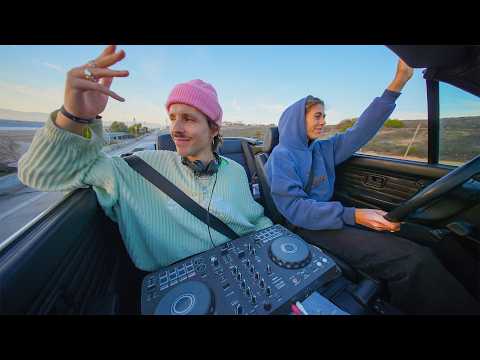 playing vibey tunes on the highway