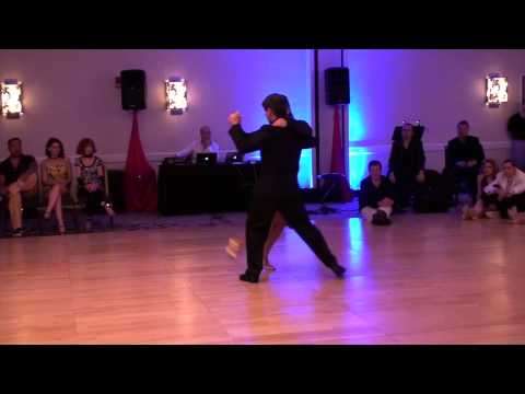  Adrian Veredice  and  Maria Blanco  are  dancing  to  the  tango  "  Todo es amor  "  at  Chicago Tango Week  in  2015