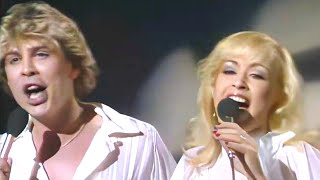 DOLLAR - HAND HELD IN BLACK AND WHITE (August, 1981) THEREZA BAZAR &amp; DAVID VAN DAY