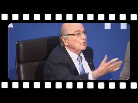 FIFA leader Sepp Blatter was showered with fake bank notes by British prankster Lee Nelson