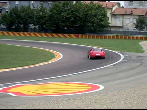 Drifting Ferrari 599 GTB Fiorano HGTE on race track Maranello / Fiorano