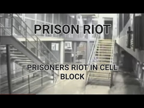 Prison riot. Prisoners take guard hostage and take over cell block.