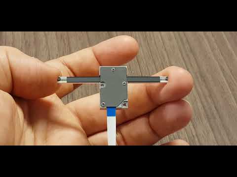 Piezo linear actuator with fixed rail and moving carriage