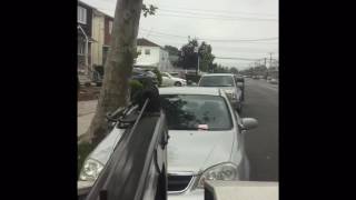 Car being towed for blocking driveway queens NYC. Justin