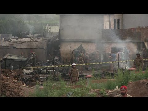 Pakistani army plane crashes into residential area | AFP