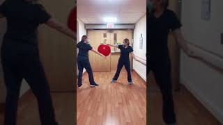 Duo of Nurses Dance Using Exercise Ball as Prop - 