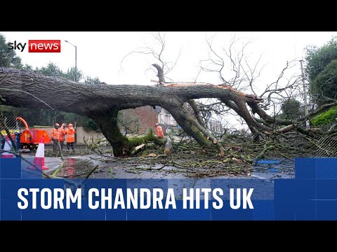 Storm Chandra: Heavy rain and wind hit UK - with travel disruption and hundreds of schools closed