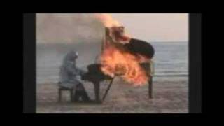 Man Playings Burning Piano