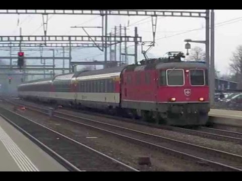Switzerland: SBB Re 4/4 II electric loco passing Liestal on a Basel to Locarno train