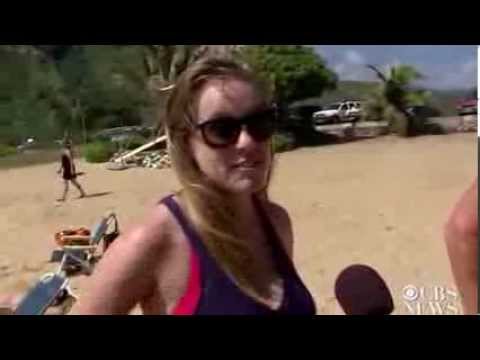 Surfing pig charms beachgoers in Hawaii