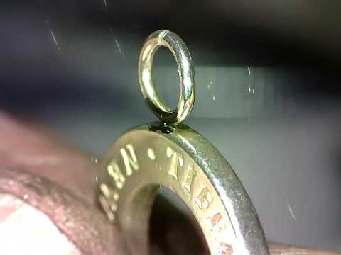 Welding a Sterling silver jump ring with a laser.