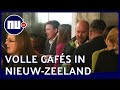 Cafés in Nieuw Zeeland vol na opheffing coronamaatregelen | NU.nl