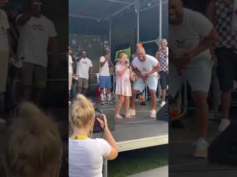 little girl called lottie singing no games inAlexandra  park Manchester with Serani