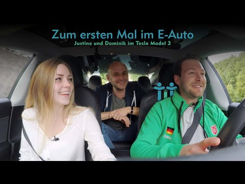 Driving a Tesla for the first time: Justine and Dominik in an electric car