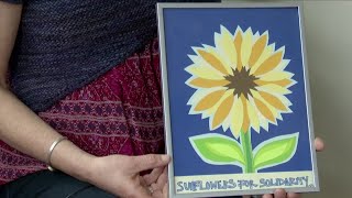 Local artists show their support to Ukraine by selling sunflower art work