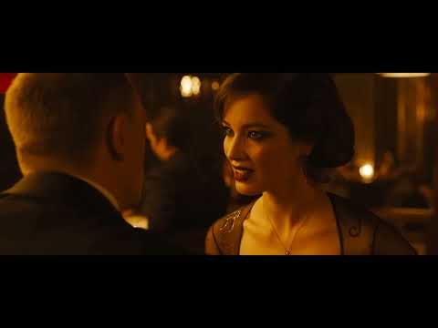 Skyfall official trailer frame — Bond on a London rooftop as the score swells toward the title sequence