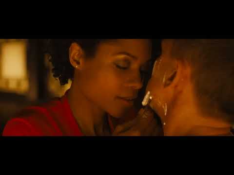 Trailer frame: the Macau casino floor glowing red-gold as the 'Komodo Dragon' cue slips in