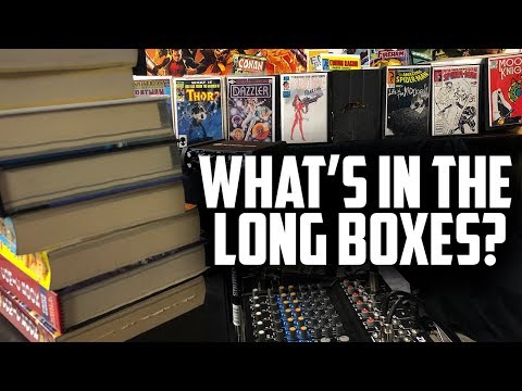 What's in the long boxes behind Comic Tom? - Viewer Comments