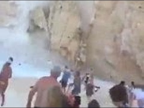 Shocking moment cliff collapses on Zante' beach in Greece