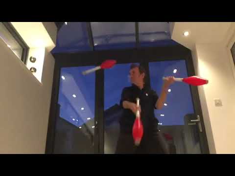 Juggling....3 clubs....chops....in slow mo!