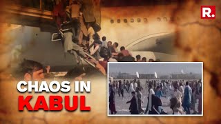 WATCH: Chaos at Kabul airport as people cling to taxiing planes &amp; fall off mid-air |Afghanistan News