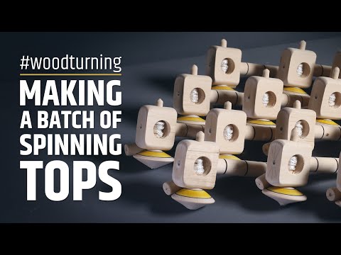 Woodturning a batch of spinning tops