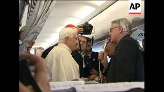Pope on plane and arriving in Malta amid abuse controversy