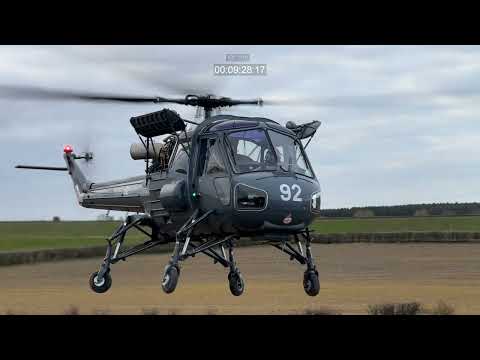 Military HELICOPTER in Action  / used in the Falklands war.