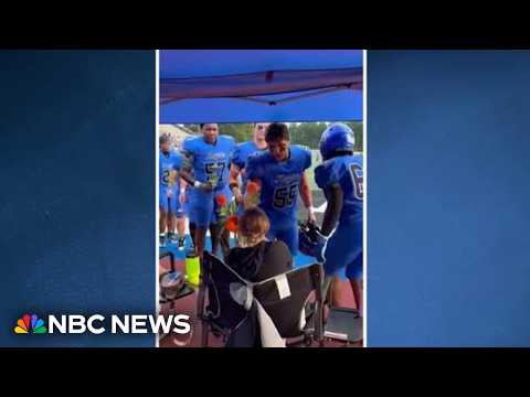 Good News: High school football team surprises mom fighting cancer with flowers