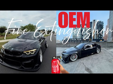 OEM Extinguisher installed on my BMW F80 M3 plus OEM door projector lights. Must have Mods!