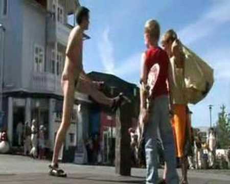 Comedian Rokkvi running in a Borat swimsuit in Reykjavik