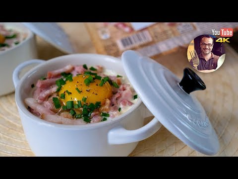 Baked eggs with seed bread, bacon and cheese