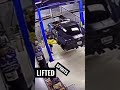 Corvette falls off a lift. Sports car disaster.