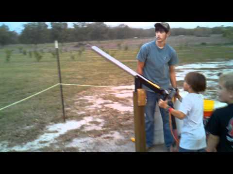 The Munas. Matthew shooting the corn cob cannon.