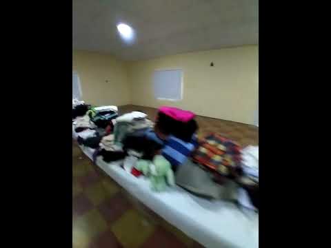 Entrega de ropa y calzados en Colonia Barge