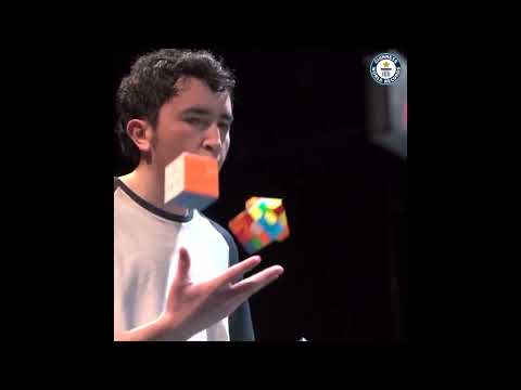 Solving Three Rubik's Cube Whilst Juggling - Guinness World Records