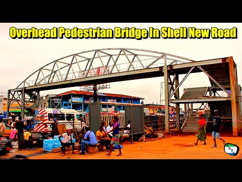 Talk To The Camera - Overhead Pedestrian Bridge Install In Shell New Road - Sierra Leone