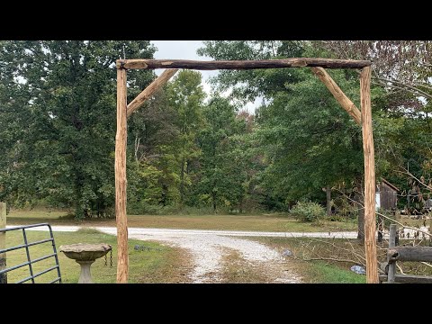 DIY log archway, one man and no heavy equipment(besides pickup)