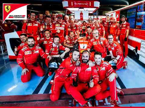 Vettel and Raikkonen with their mechanics