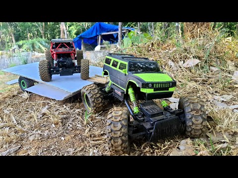 hb rock crawler and hummer rock crawler pulling test|pulling 2 cars and a big rock|who can do it?