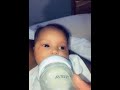 Dad scares baby while feeding her by sneezing.