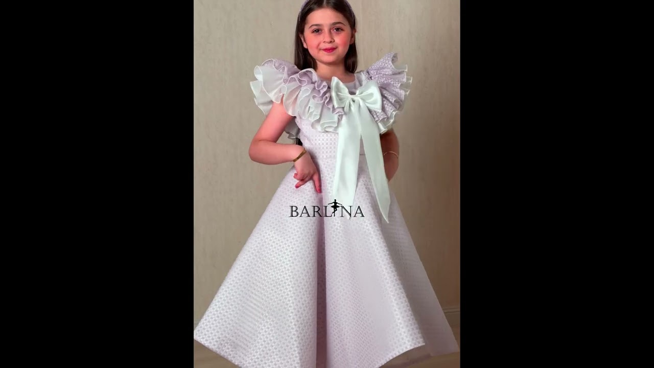 Purple girl's dress decorated with a large bow - year 1