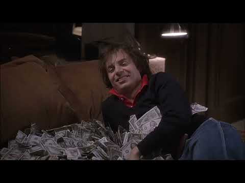 Official 1998 trailer frame for 54: disco floor, mirror-ball glare, crowd rush