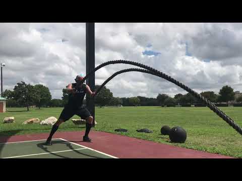 Battle rope side to side squat jump w/waves