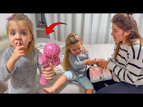 MELANIA secretly took ERNEST's KENDAMA