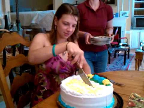 Erickson cuts the cake.