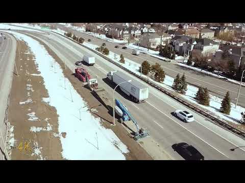 North York: Aerial view of boom lift being towed on Allen Road 3-15-2023