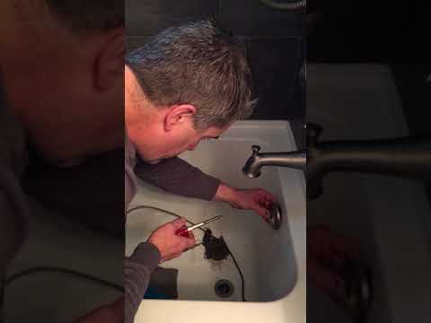 Geoff from Gelco Plumbing & Heating shows you how to fix a plugged bathtub drain with an auger.