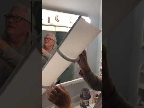 Replacing an EzLightWraps shade on a medicine cabinet light using glue strips!